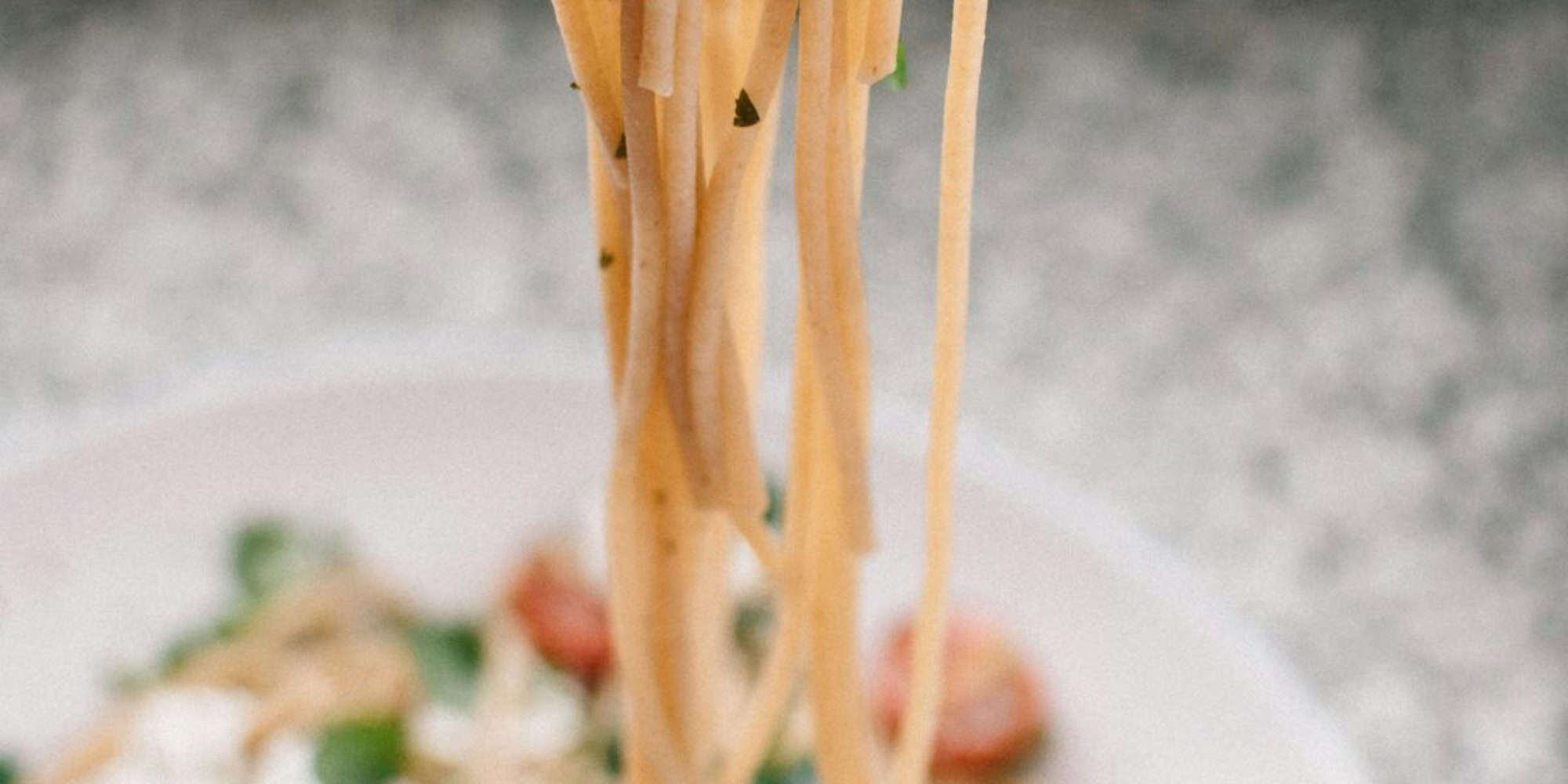 Delicious Italian pasta dish with fresh vegetables on a rustic plate