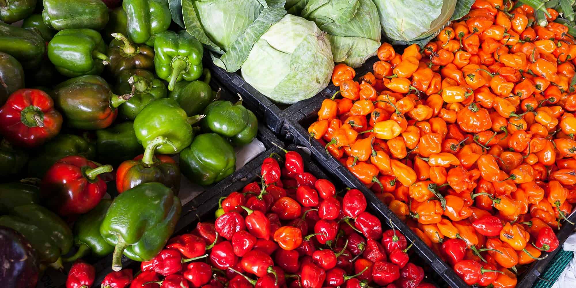 Colorful fresh produce at an Italian outdoor market in Puglia